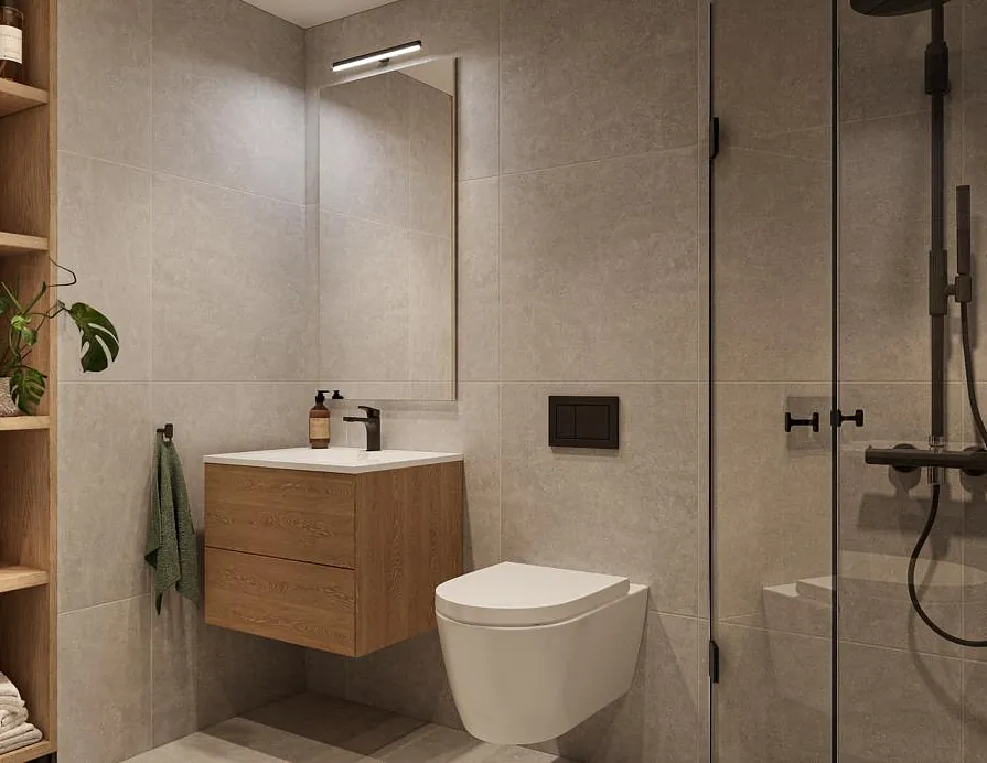 Moderne bad med grå fliser, vegghengt toalett, dusjhjørne og innredning i treverk.